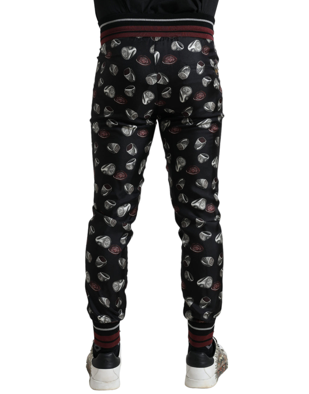 Pantalons de jogging en soie noirs Dolce & Gabbana, style décontracté et élégant, avec détails subtils et finition soignée.