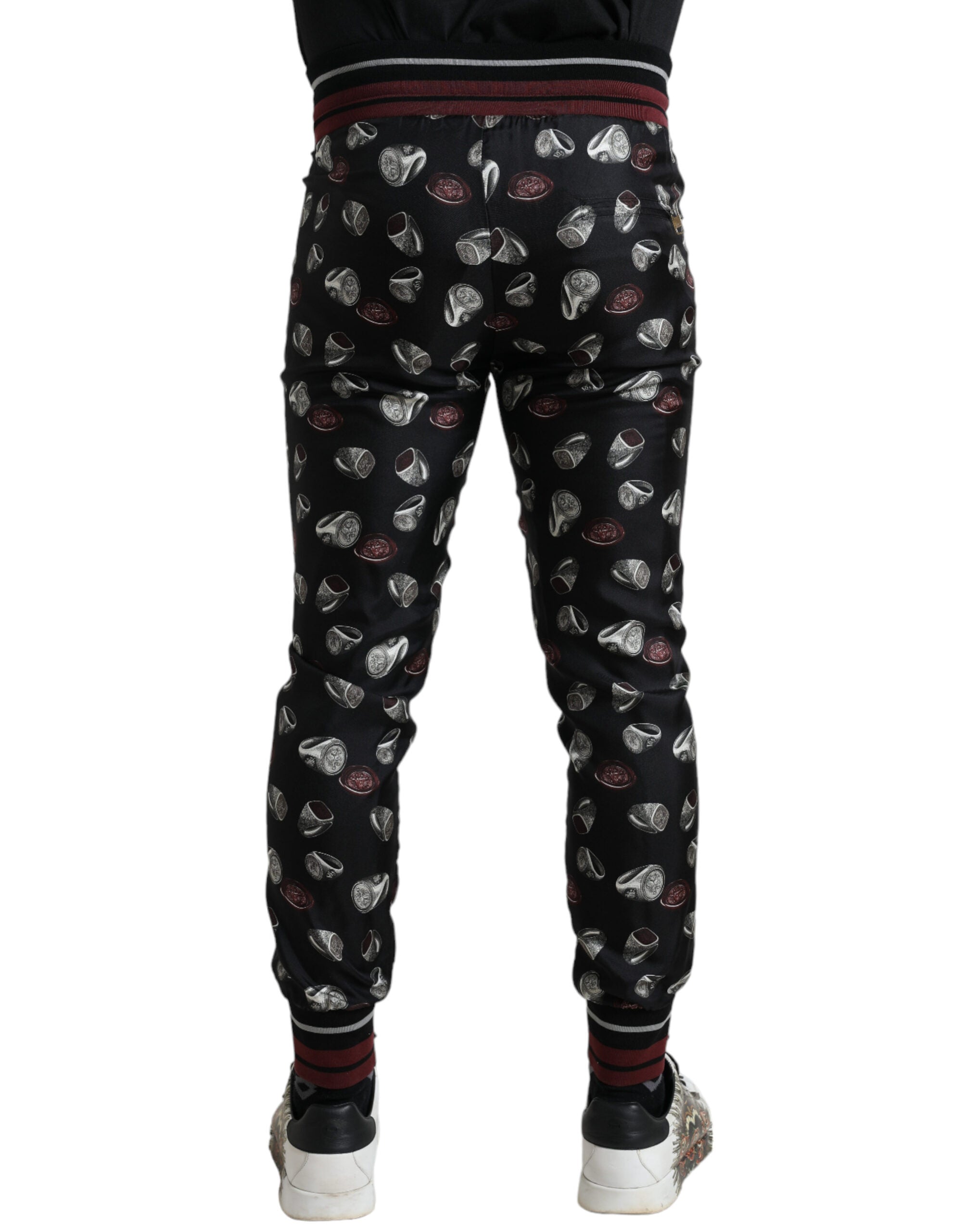 Pantalons de jogging en soie noirs Dolce & Gabbana, style décontracté et élégant, avec détails subtils et finition soignée.