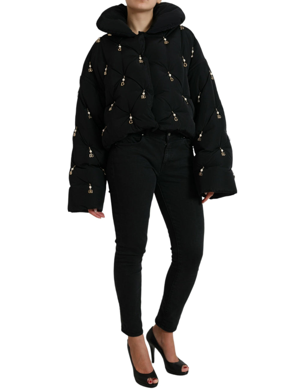 Veste bomber matelassée noire Dolce & Gabbana avec embellissements et doublure en coquille, style élégant et tendance.