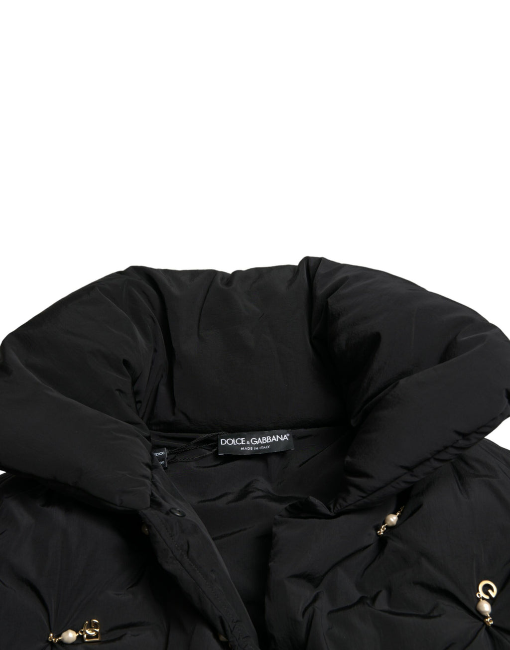 Veste bomber matelassée noire Dolce & Gabbana avec embellissements, design élégant et moderne, vue de face sur la veste.