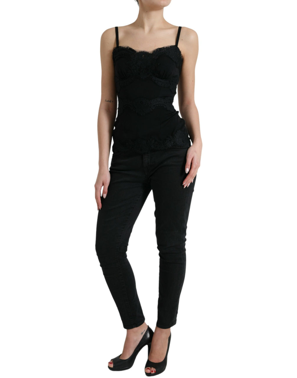 Débardeur sans manches en soie stretch noire avec dentelle, de la marque Dolce & Gabbana, visible avec détails élégants en image.