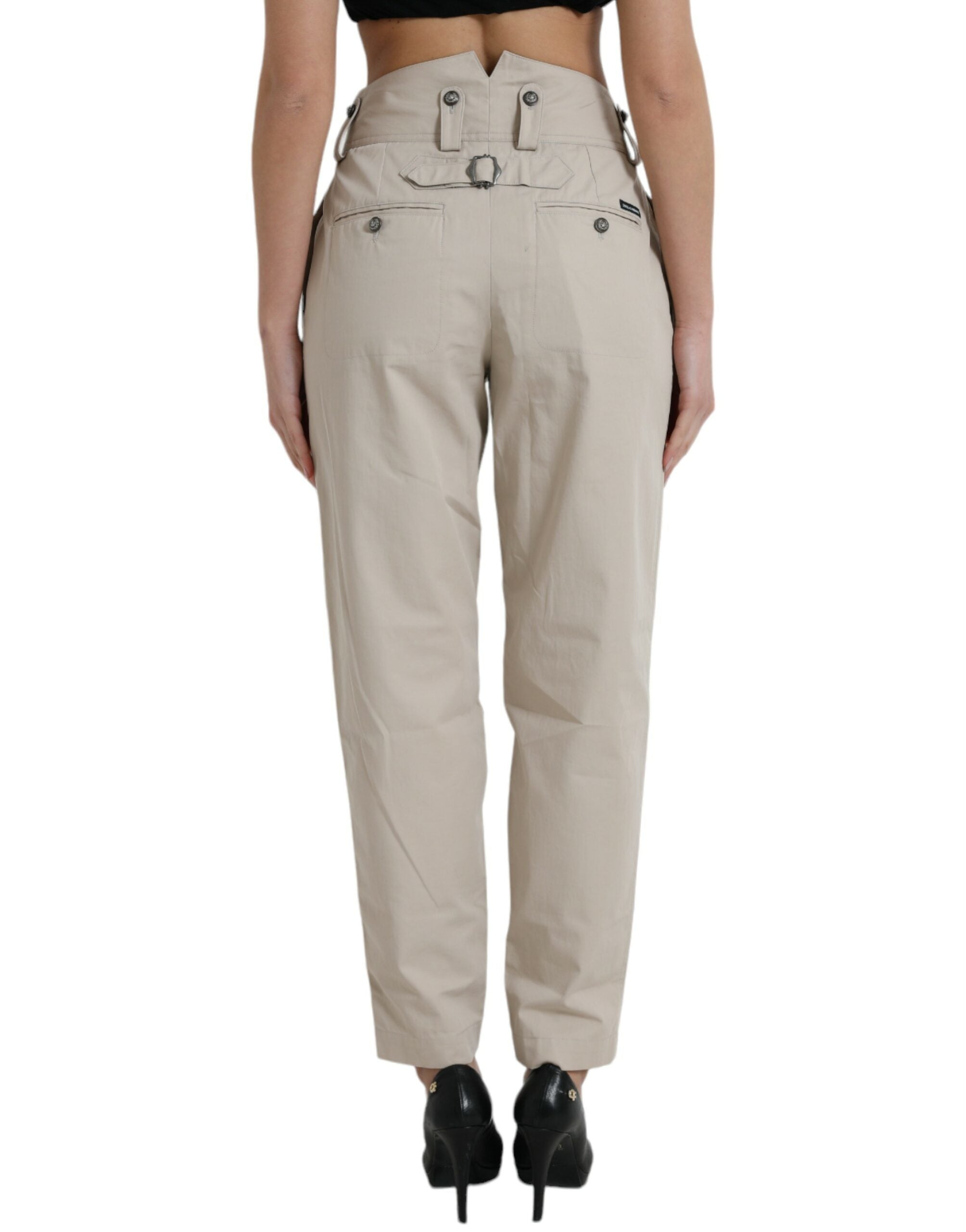 Pantalons beige en coton à taille haute et coupe tapered de Dolce & Gabbana, vue de face.