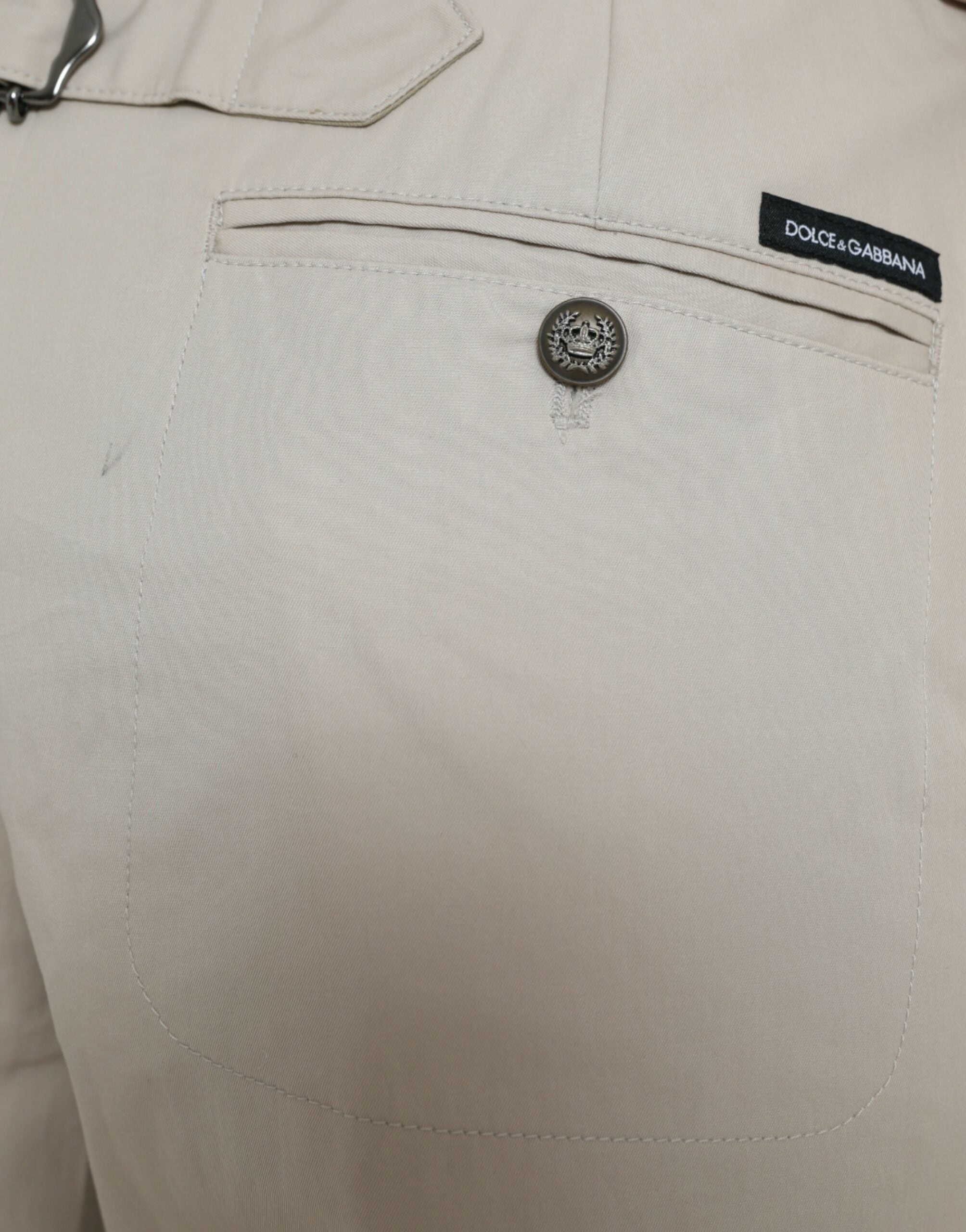 Pantalons beige en coton taille haute et tapered de Dolce & Gabbana, vue de face, détails du tissu et de la coupe.