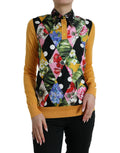 Pull en cachemire Dolce & Gabbana à patchwork multicolore avec col Henley, détails colorés et tissu doux visible sur l'image.