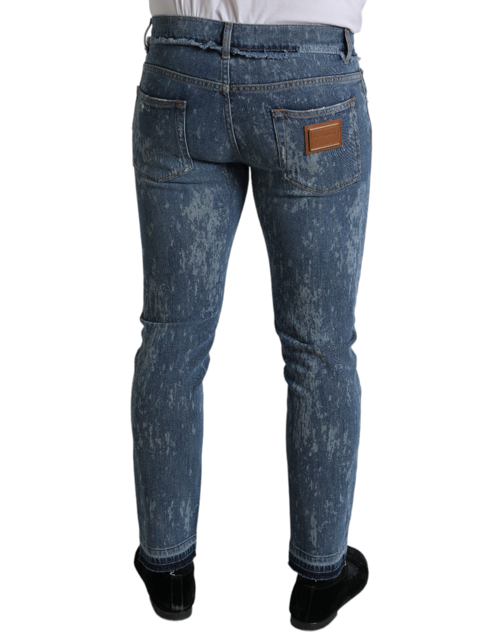 Jeans slim en denim coton stretch bleu délavé de Dolce & Gabbana, coupe skinny, visible détails et finition élégante.