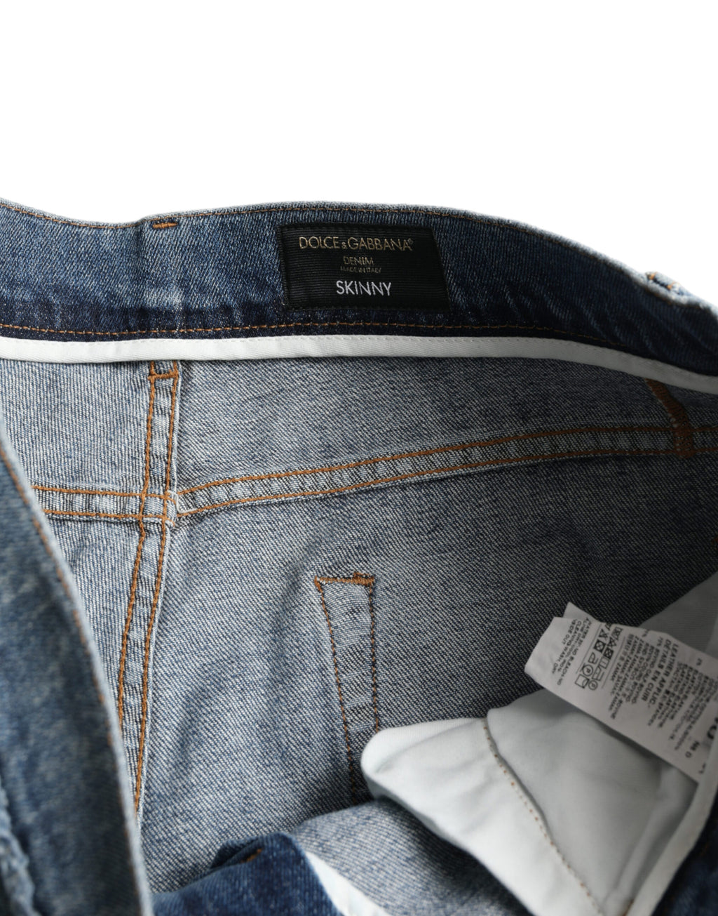 Jean skinny en denim extensible en coton bleu délavé de Dolce & Gabbana, ajusté et tendance.