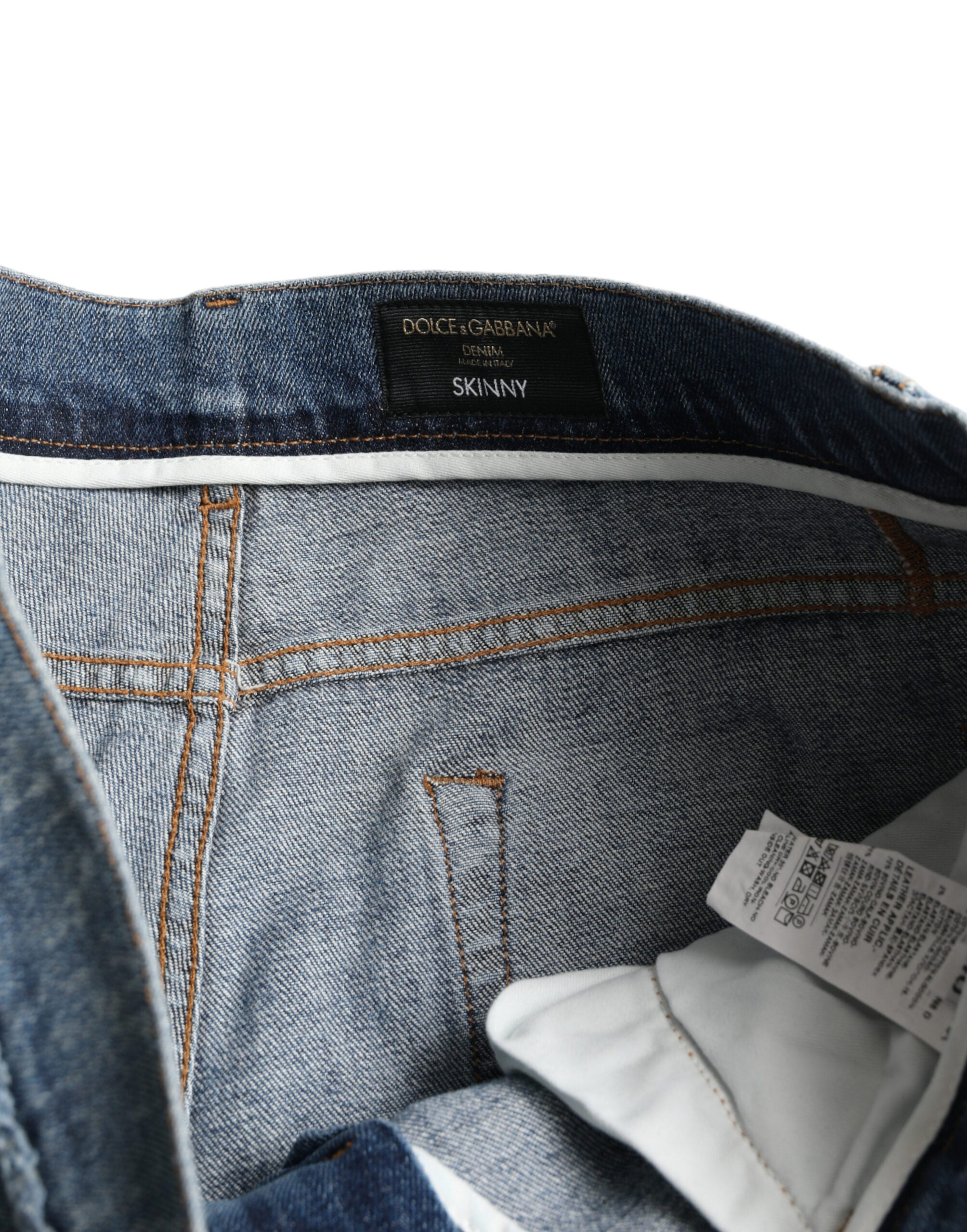 Jean skinny en denim extensible en coton bleu délavé de Dolce & Gabbana, ajusté et tendance.