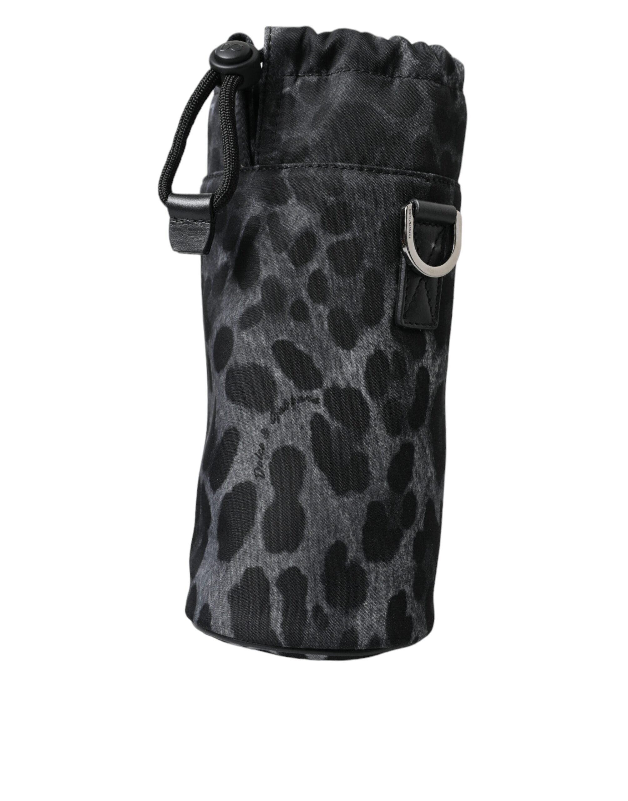 Sac Dolce & Gabbana noir à motif léopard rond, sac à main fin et élégant avec porte-bouteille intégré.