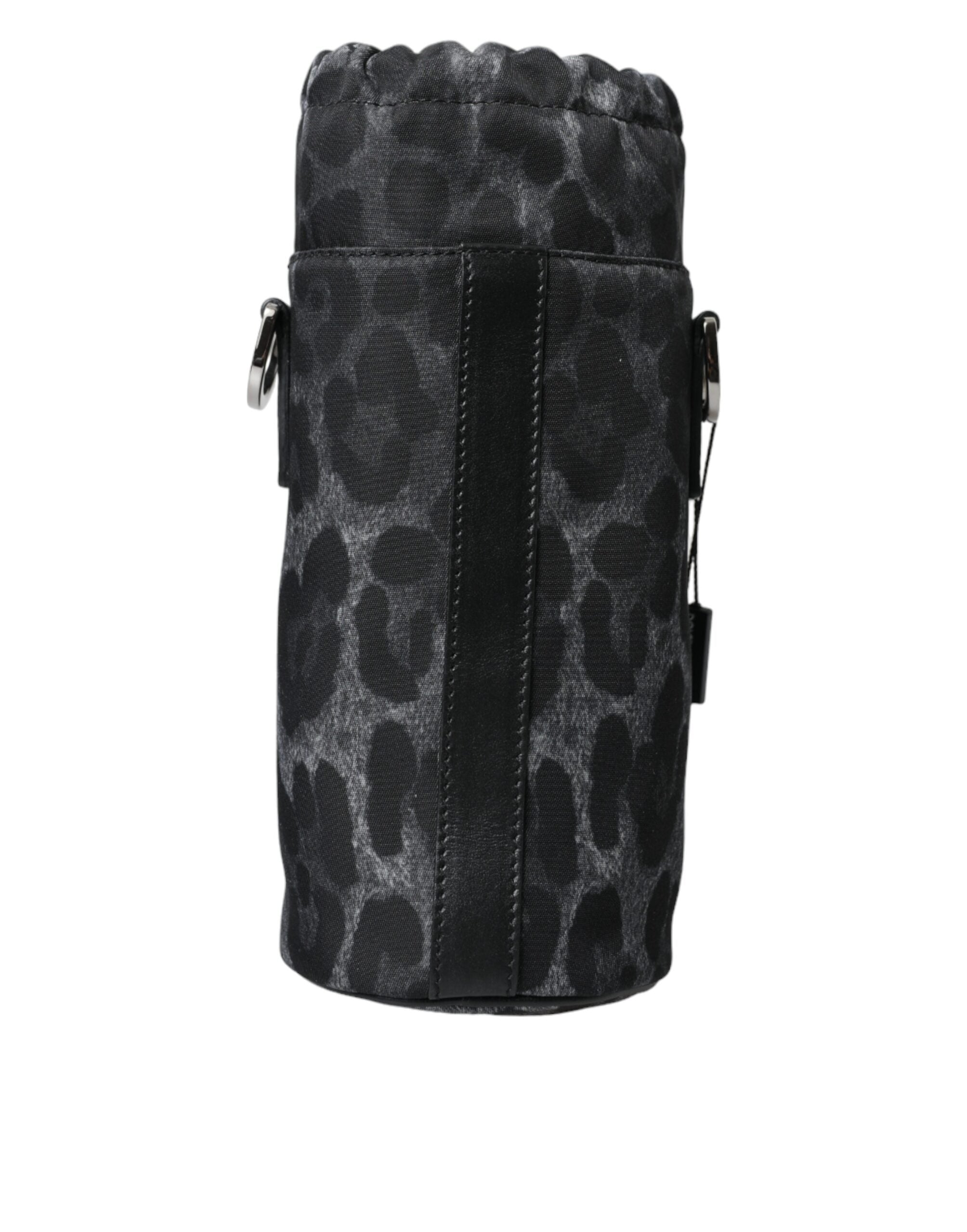 Sac à main Dolce & Gabbana noir avec motif léopard rond et élégant, design slim pour bouteille ou accessoires.