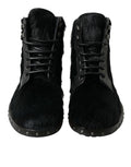 Bottes en cuir noir de style pony pour mi-mollet de la marque Dolce & Gabbana, élégantes et sophistiquées.