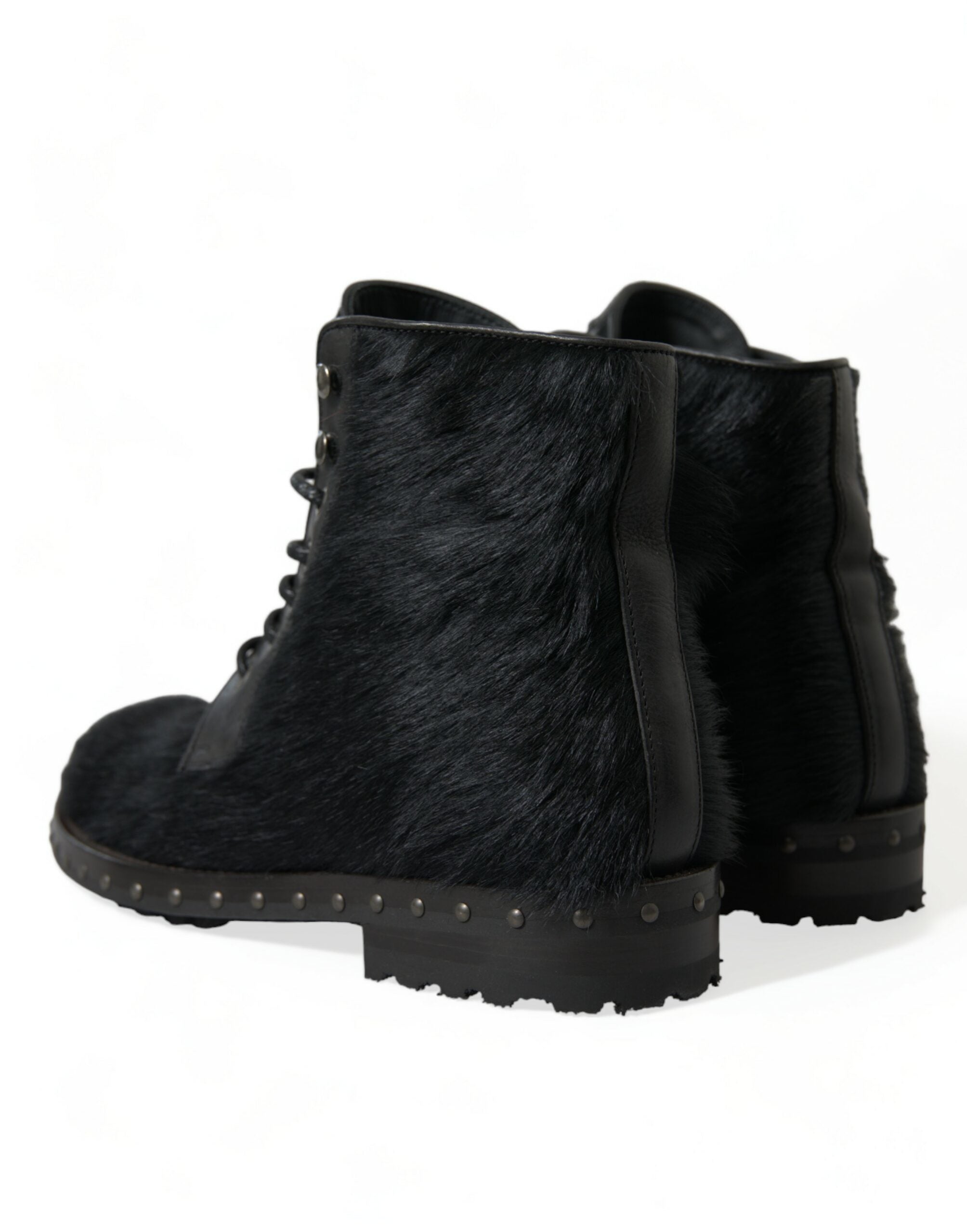 Bottes mi-mollet en cuir noir style pony de Dolce & Gabbana, chaussures élégantes avec finition raffinée.
