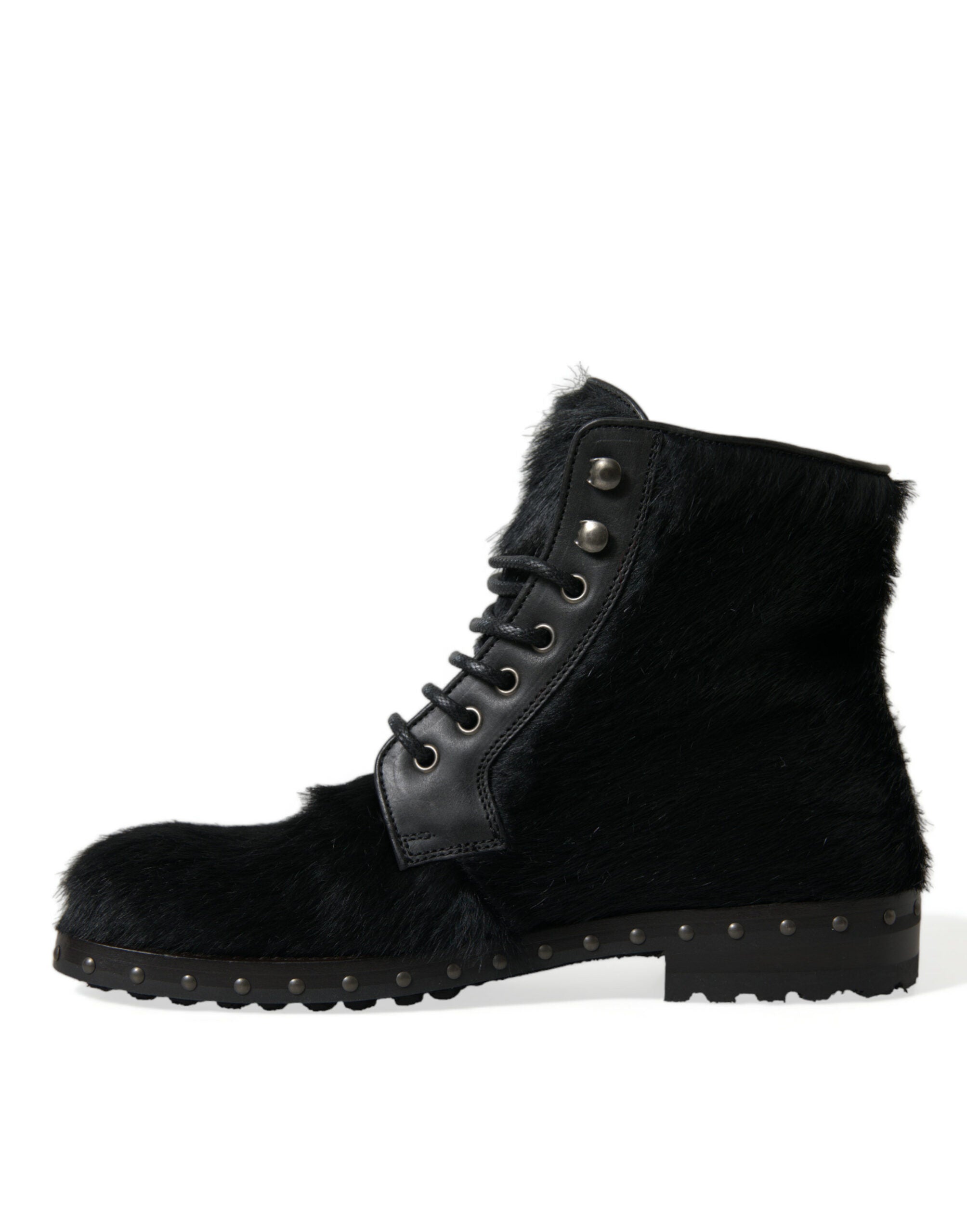 Bottes en cuir noir style pony Dolce & Gabbana, mi-mollet, avec talon élégant et finition sophistiquée.