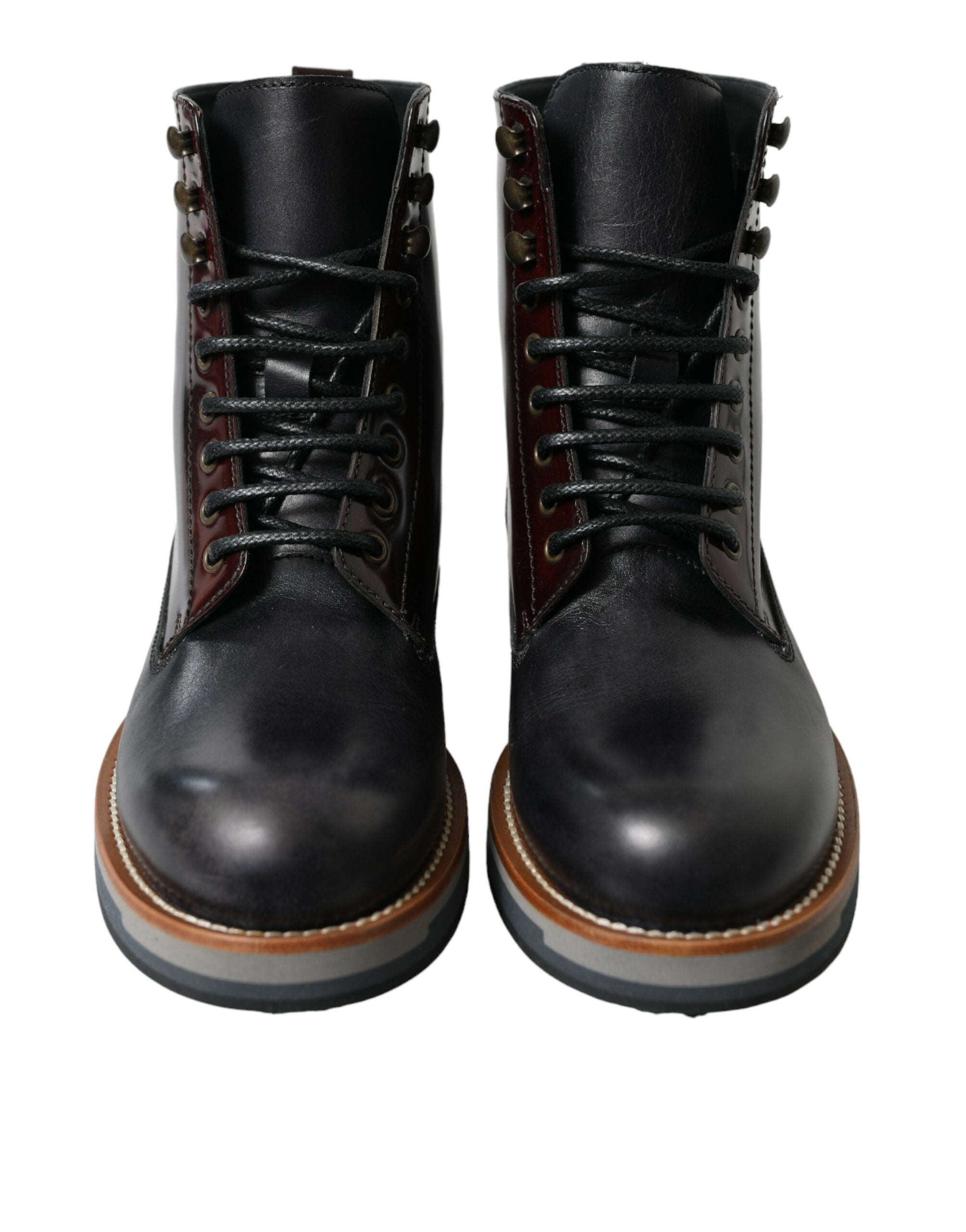 Bottes de combat en cuir noir Dolce & Gabbana, style militaire, chaussures robustes et élégantes pour femmes et hommes.