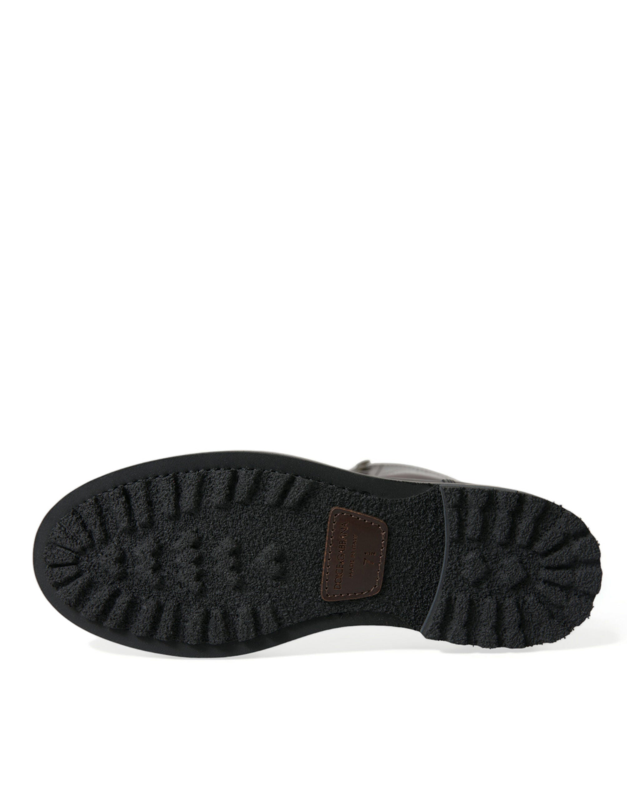 Chaussures de combat en cuir noir Dolce & Gabbana, bottines militaires élégantes avec semelle robuste et détails modernes.