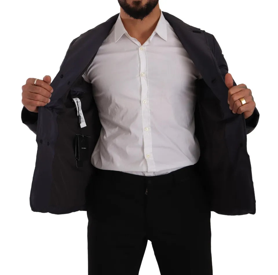 Veste d'hiver Dolce & Gabbana en soie bleue avec coupe blouson et détails élégants, adaptée pour la saison froide.