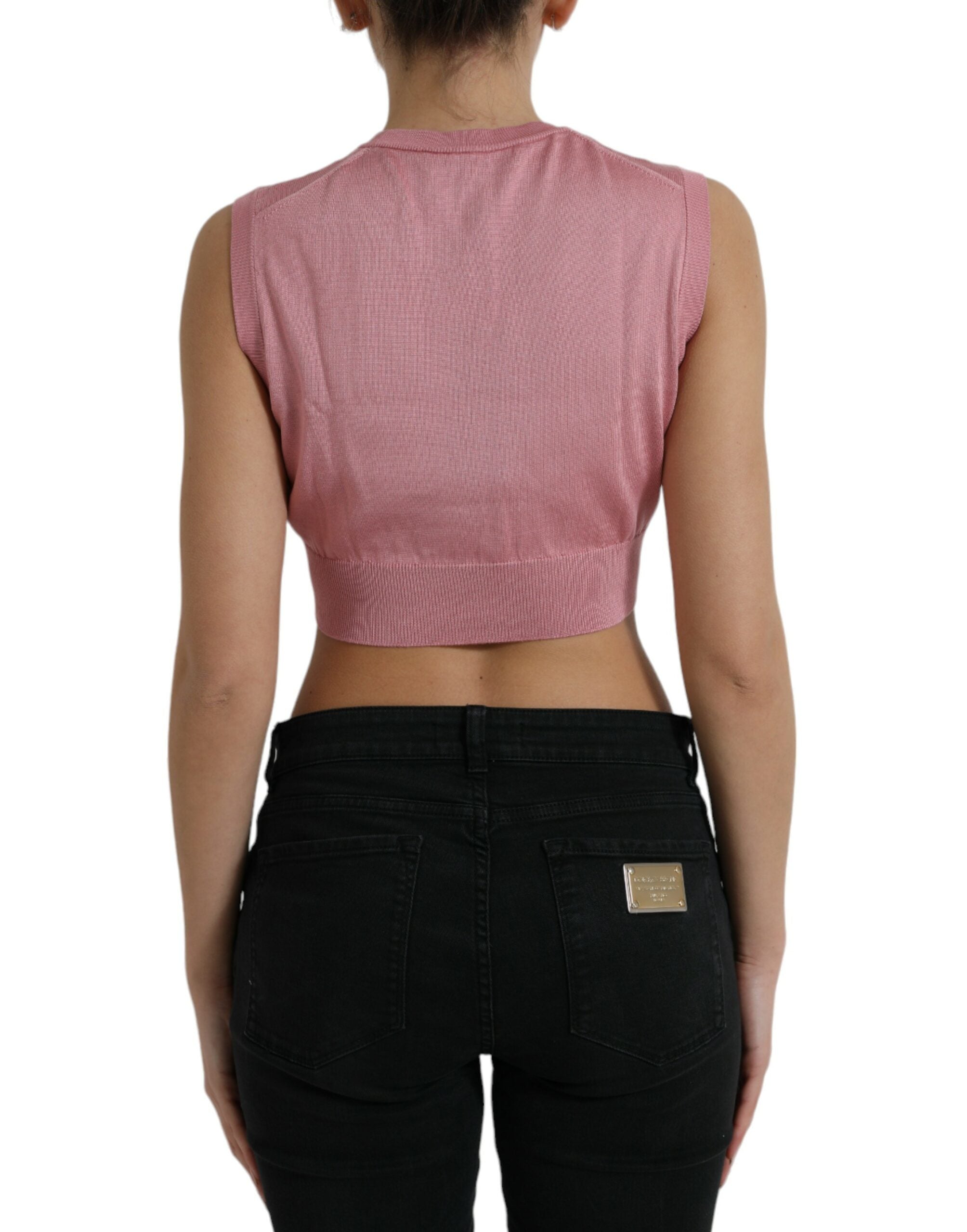 Débardeur court sans manches rose Dolce & Gabbana avec col ras du cou, porté sur une mannequin.