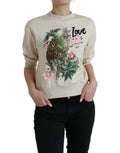 Pull à manches longues Dolce & Gabbana en coton beige avec motif jungle imprimé, élégant et confortable.