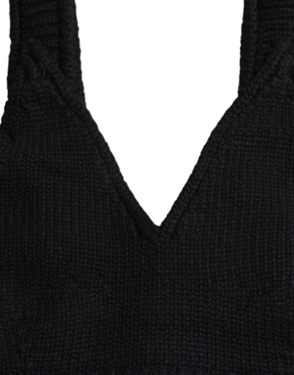 Top bustier noir en cachemire Dolce & Gabbana avec col en V, coupe cropped, visible détail de tissu et finition élégante.