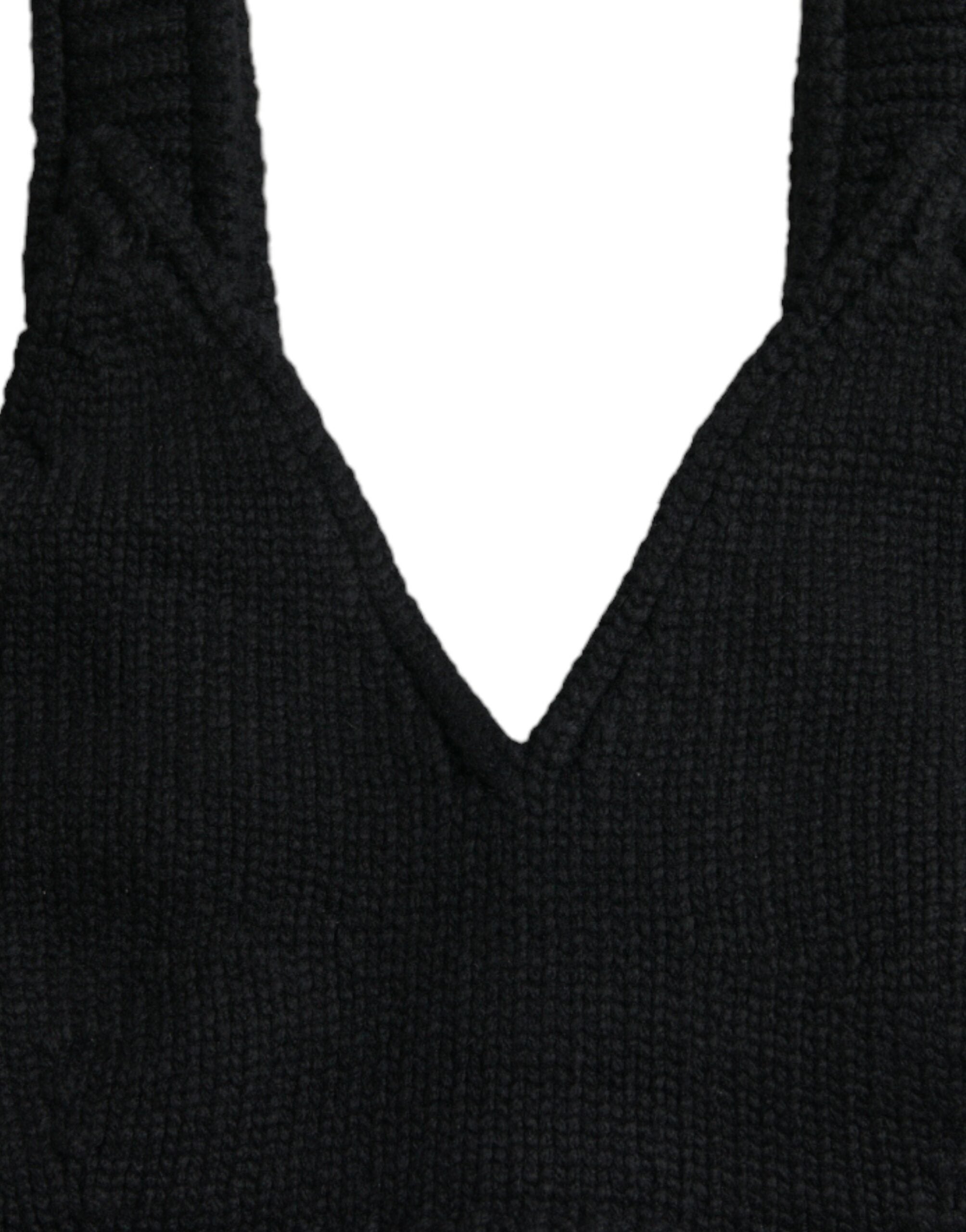 Top bustier noir en cachemire Dolce & Gabbana avec col en V, coupe cropped, visible détail de tissu et finition élégante.