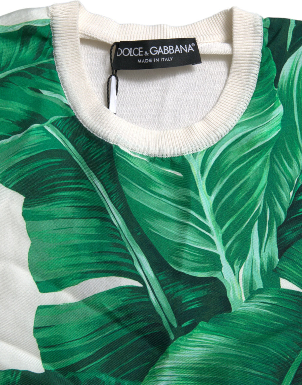 Débardeur blanc Dolce & Gabbana avec motif de feuilles de bananier, col rond, tissu léger et élégant.