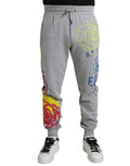 Pantalons jogger Dolce & Gabbana en coton gris avec motif graffiti, style décontracté et tendance pour homme.