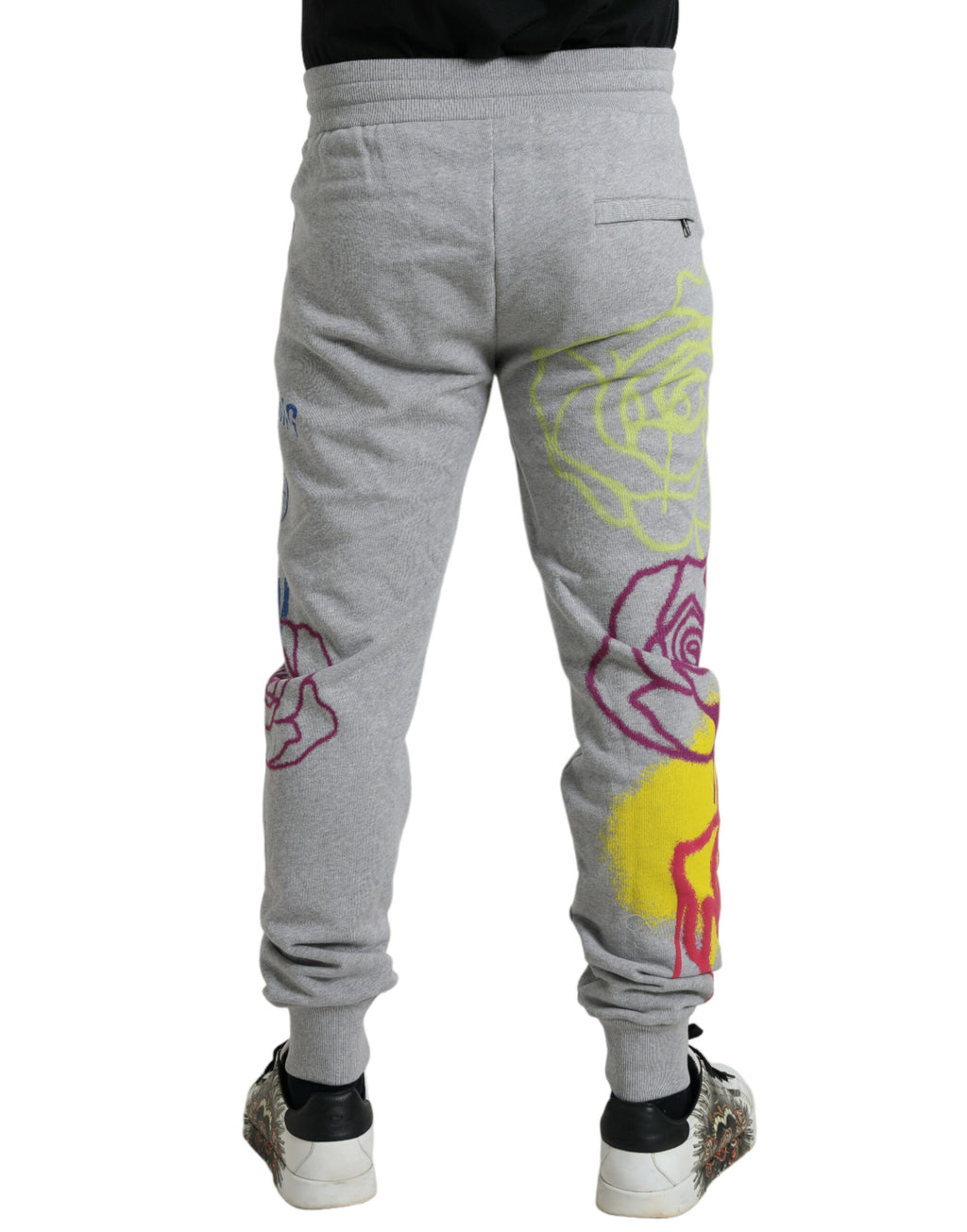 Pantalons jogger Dolce & Gabbana en coton gris avec motif graffiti, style décontracté et confortable.