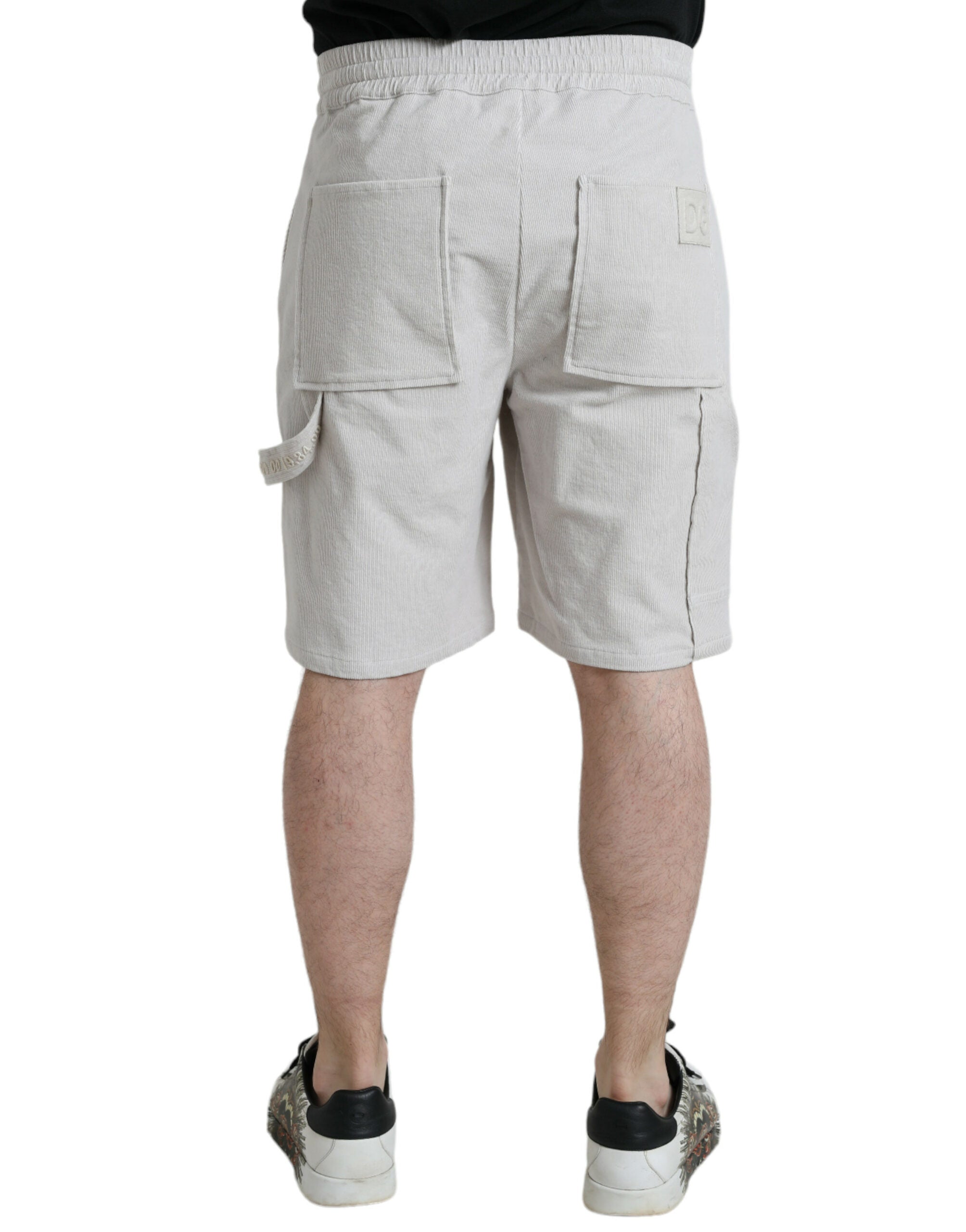 Shorts bermuda en coton beige Dolce & Gabbana avec logo en corduroy, style élégant et décontracté.