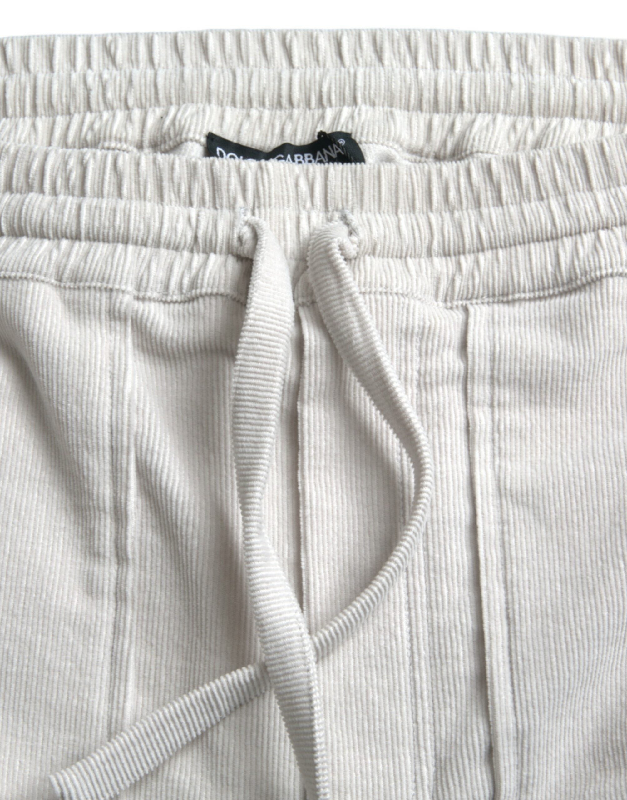 Shorts bermuda en coton beige avec logo Dolce & Gabbana, en tissu côtelé, pour un style élégant et décontracté.