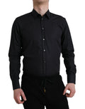 Chemise formelle en coton bleu marine de Dolce & Gabbana avec col, visible sur la photo.