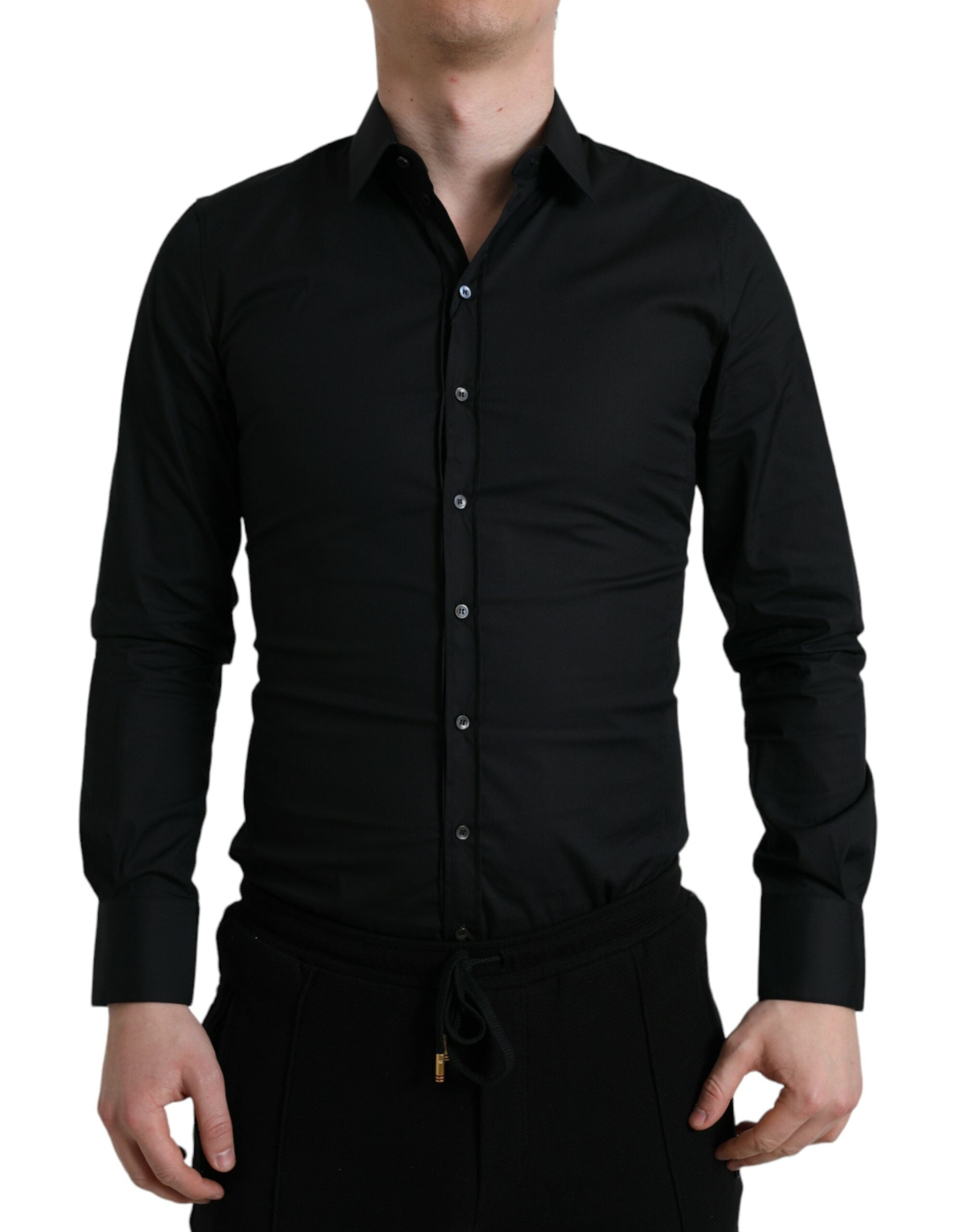 Chemise formelle noire en coton stretch de Dolce & Gabbana, slim et élégante, visible en gros plan sur l'image.