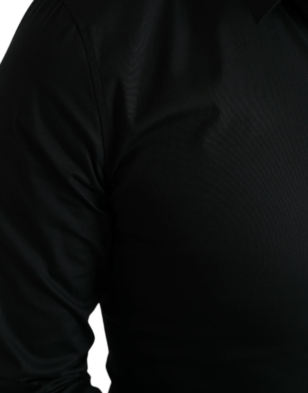 Chemise noire en coton stretch Dolce & Gabbana, coupe slim, chemise formelle élégante avec col classique et boutons visibles.