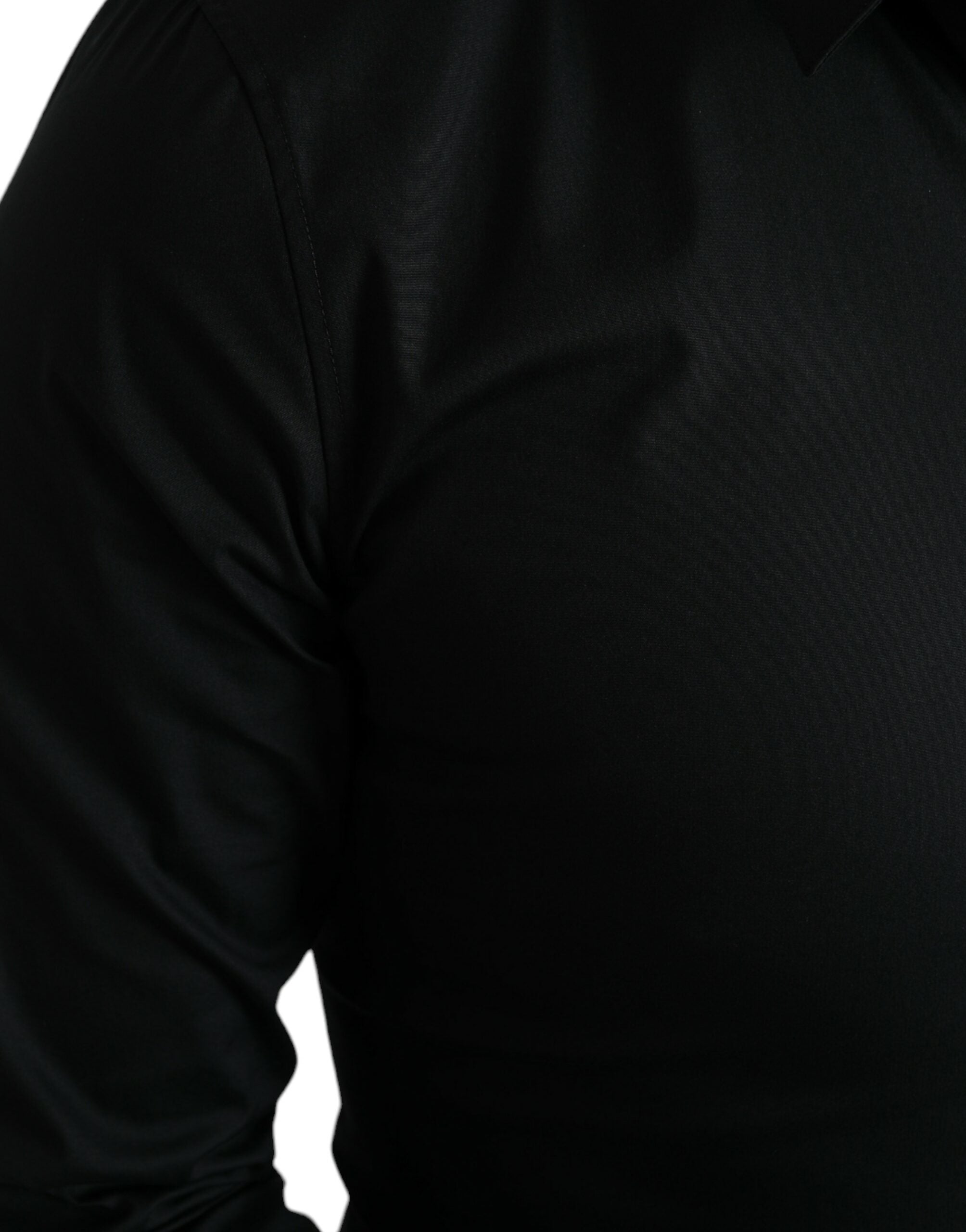 Chemise noire en coton stretch Dolce & Gabbana, coupe slim, chemise formelle élégante avec col classique et boutons visibles.
