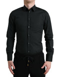 Chemise formelle en coton et soie noire Dolce & Gabbana avec détails en or, vue de face sur une mannequin.