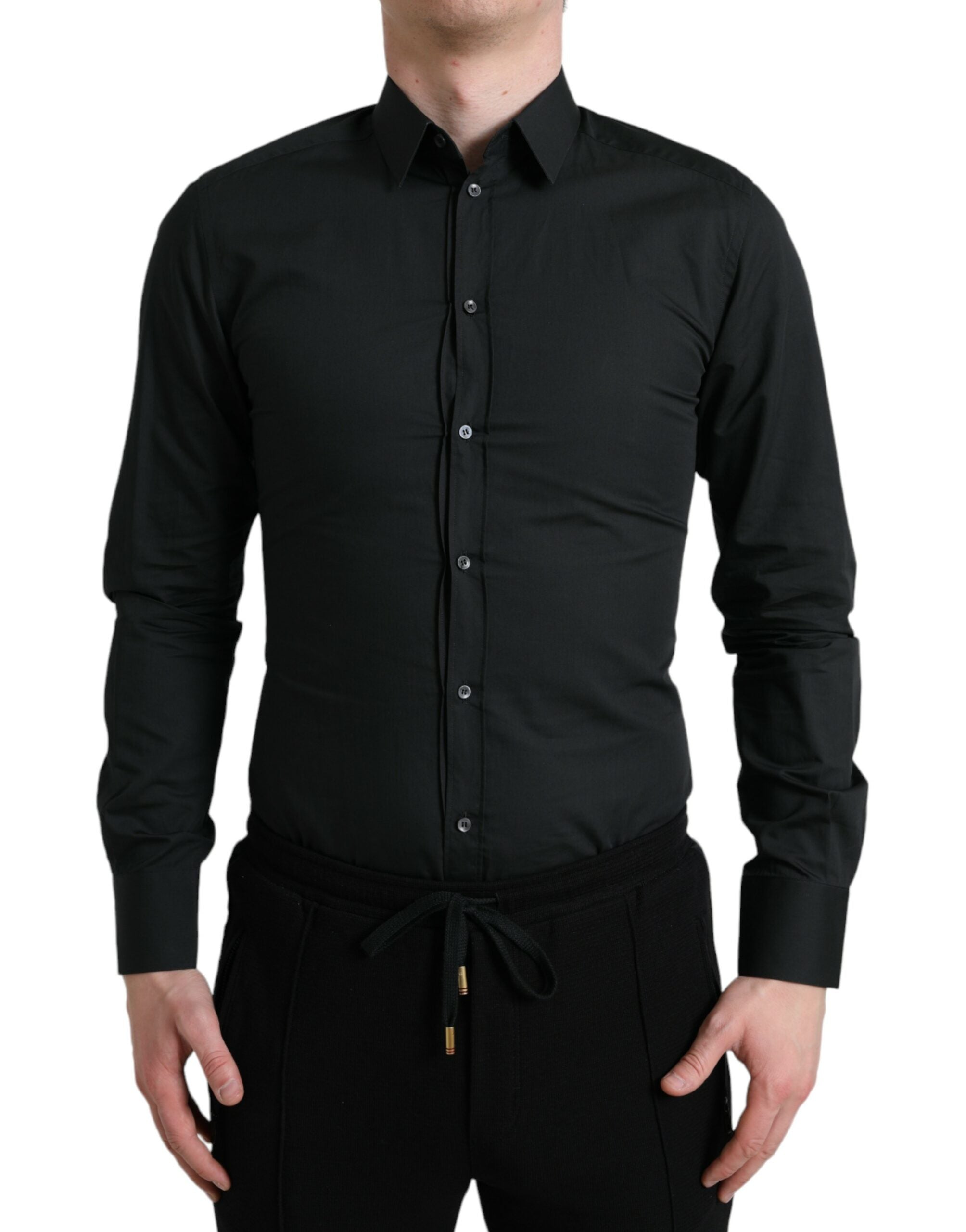 Chemise formelle en coton et soie noire Dolce & Gabbana avec détails en or, vue de face sur une mannequin.