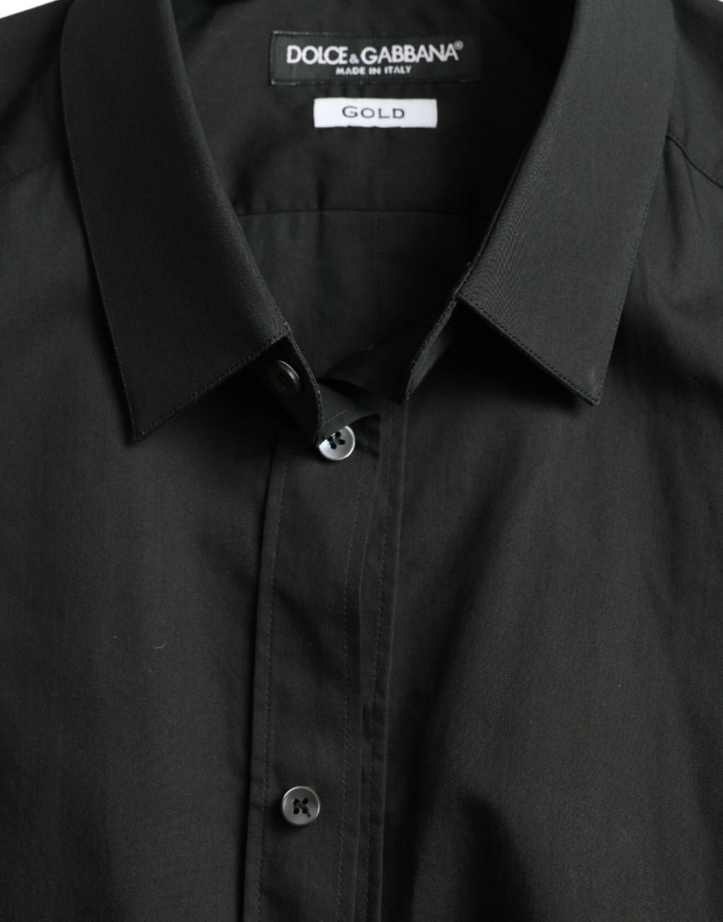 Chemise formelle en coton et soie noire Dolce & Gabbana avec détails en or, vue de face.