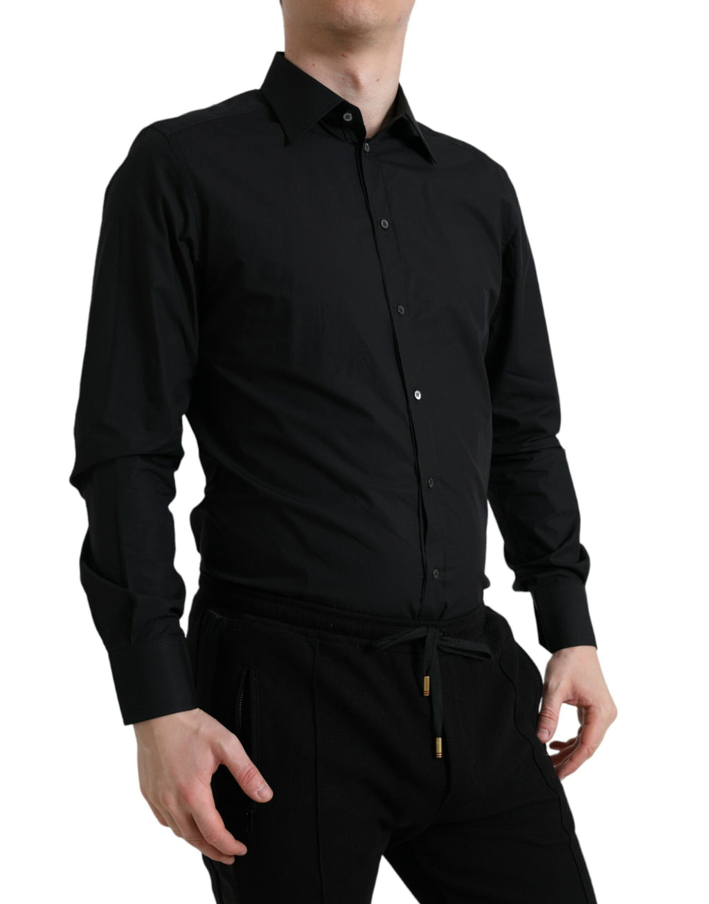 Chemise formelle noire en coton Dolce & Gabbana pour homme avec détails dorés, vue de face sur fond blanc.