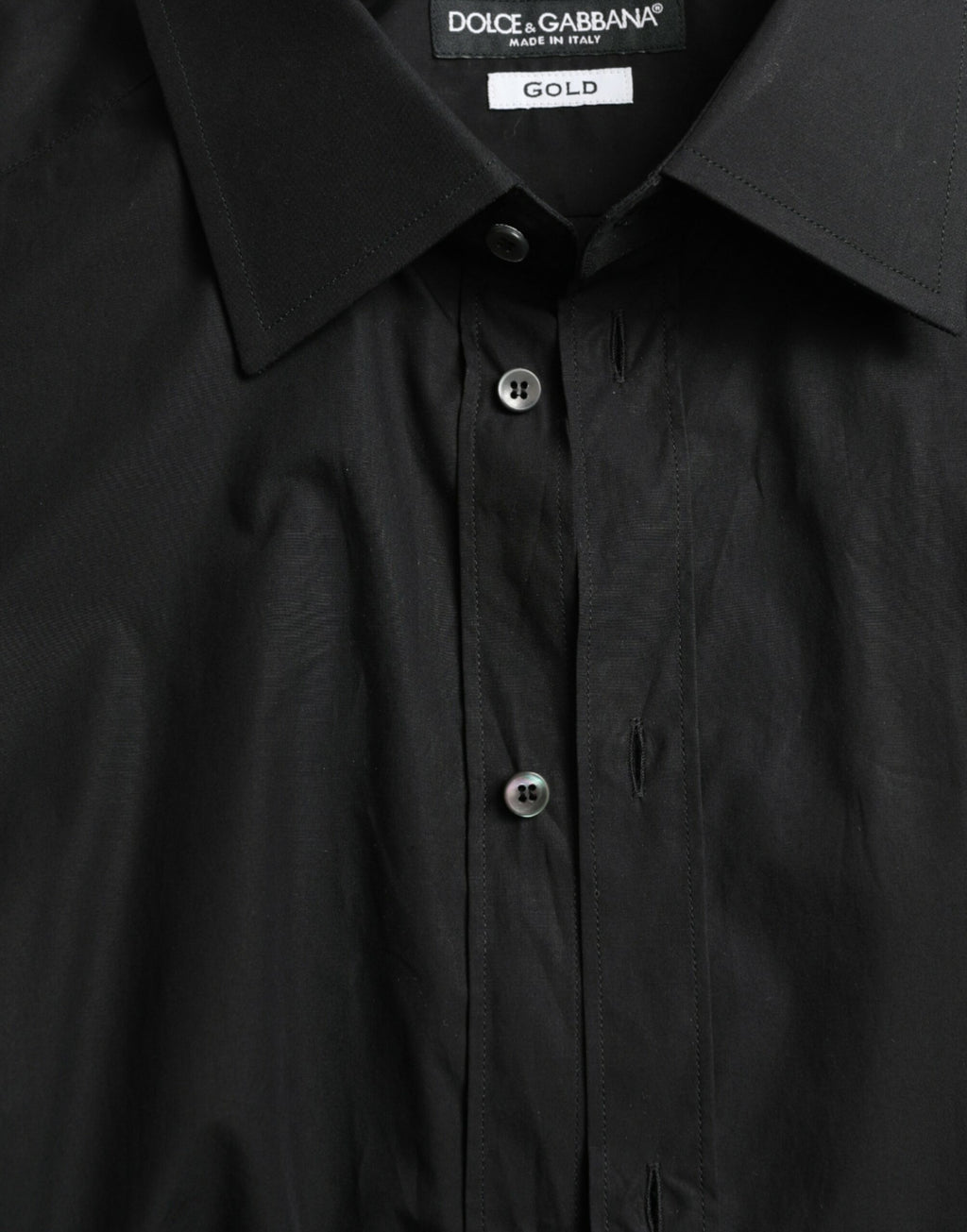 Chemise homme noire en coton Dolce & Gabbana, chemise formelle dorée avec boutons, style élégant et sophistiqué.