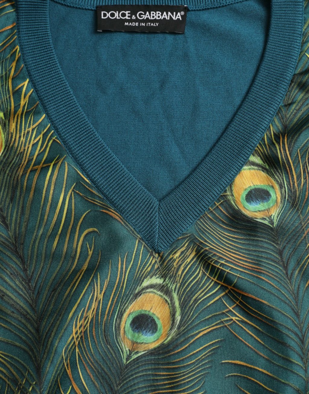 Pull à manches longues Dolce & Gabbana avec motif plumes de paon vert, doux et élégant, en laine ou coton.