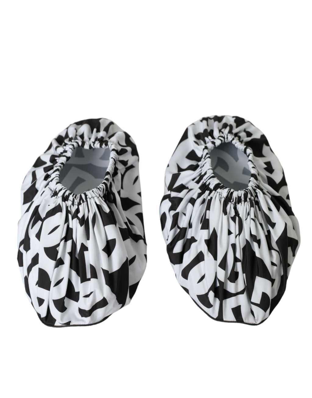 Chaussures plates en nylon blanc Dolce & Gabbana avec logo imprimé, slip-on, style élégant et confortable.