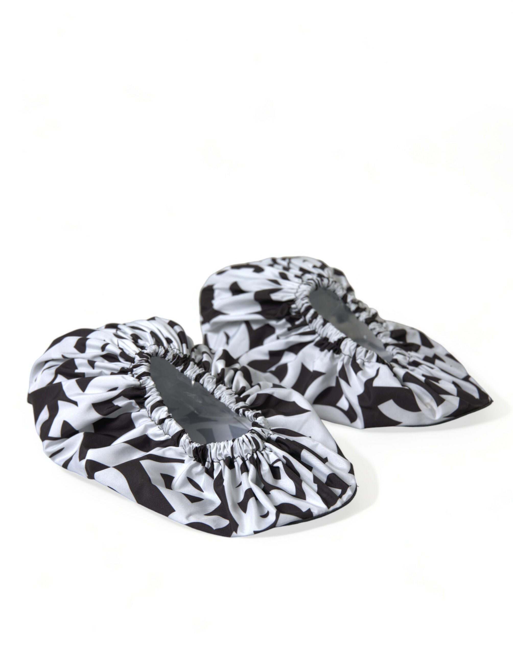 Chaussures plates en nylon blanc Dolce & Gabbana avec logo imprimé, slip-on élégants et confortables.