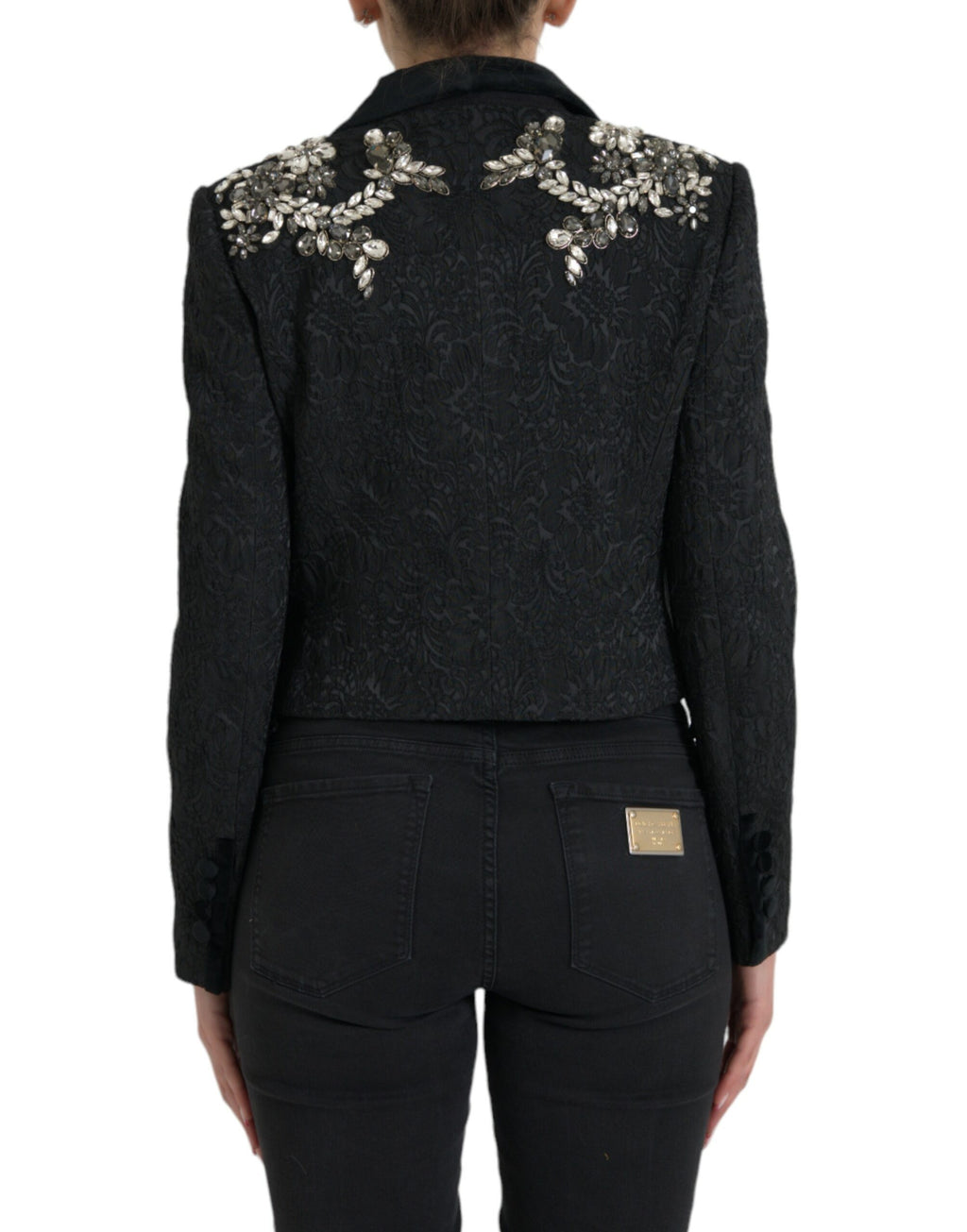 Manteau noir Dolce & Gabbana avec embellissements en cristal, coupe élégante et détails sophistiqués.