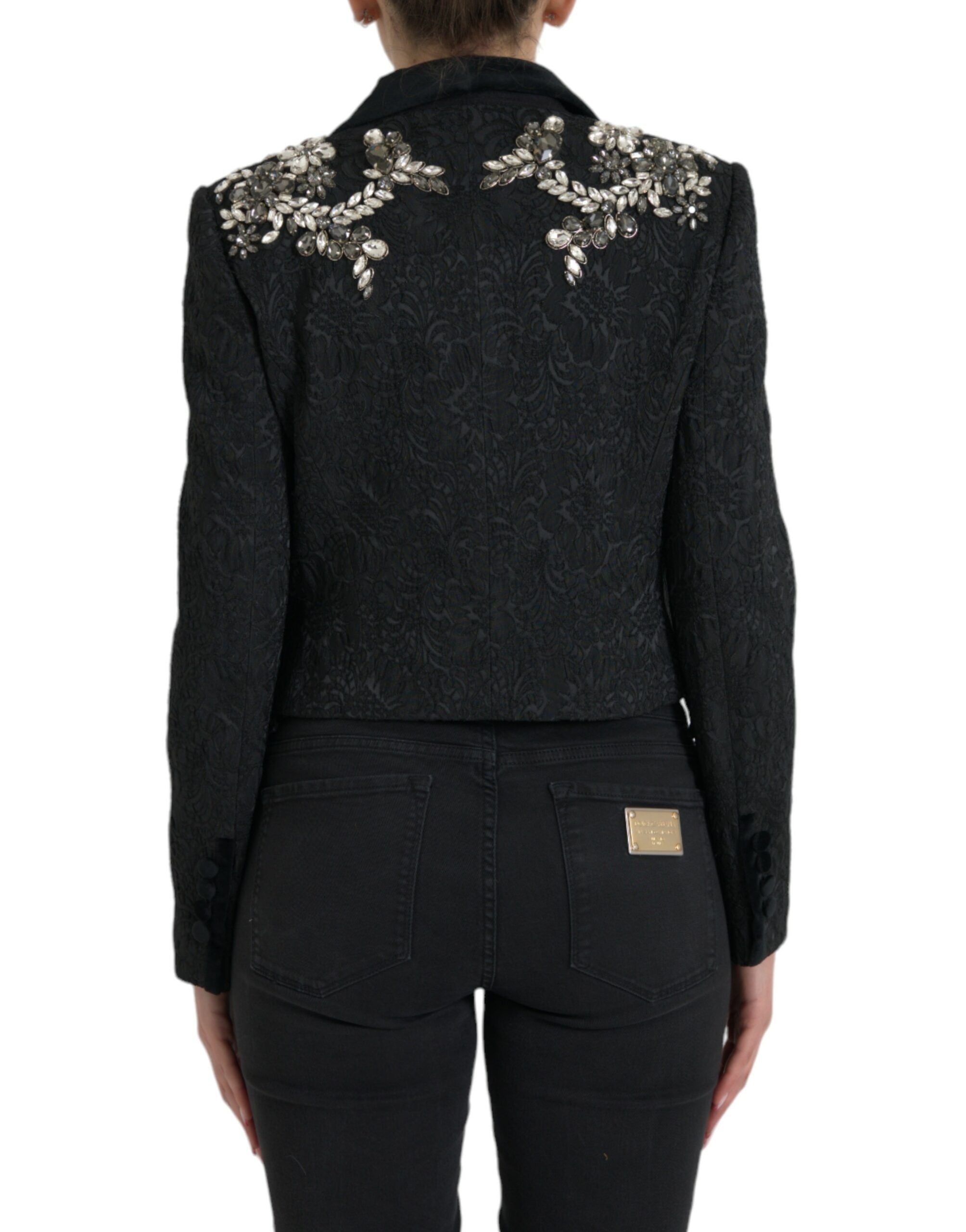Manteau noir Dolce & Gabbana avec embellissements en cristal, coupe élégante et détails sophistiqués.