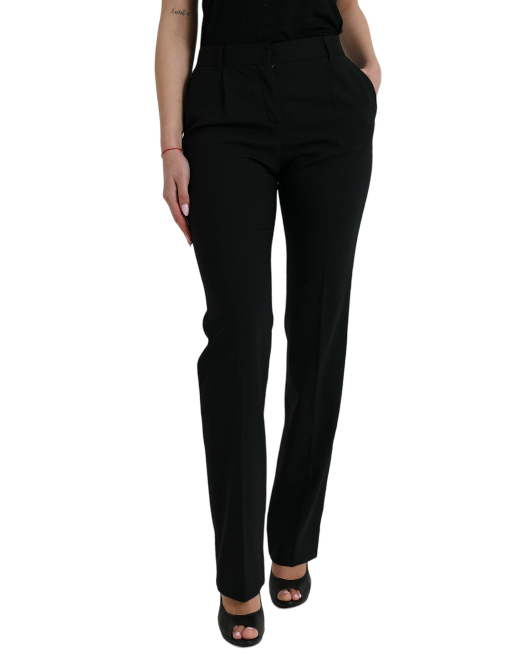 Pantalon tapered en laine noire Dolce & Gabbana à taille moyenne, vue de face, élégant et ajusté.