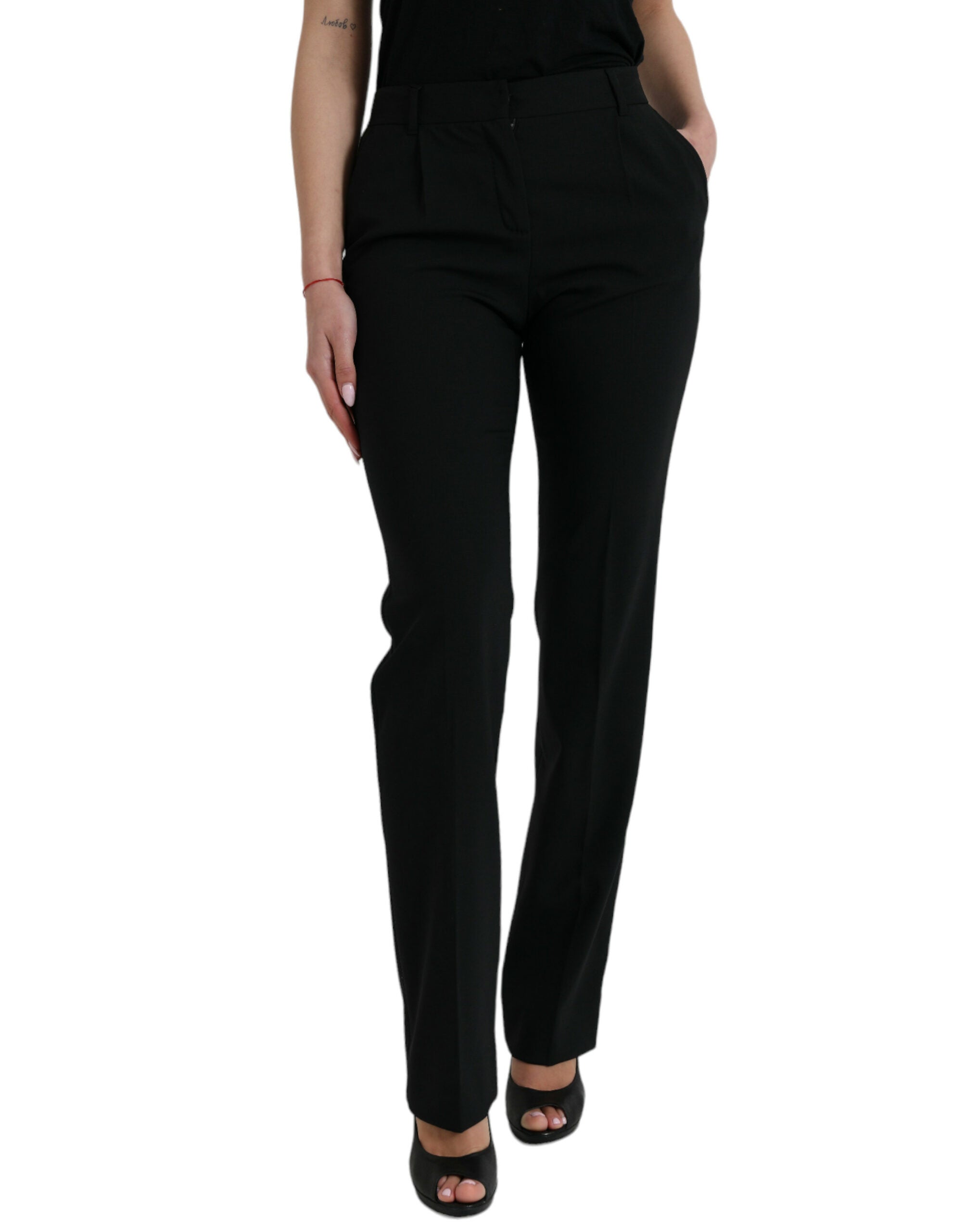 Pantalon tapered en laine noire Dolce & Gabbana à taille moyenne, vue de face, élégant et ajusté.