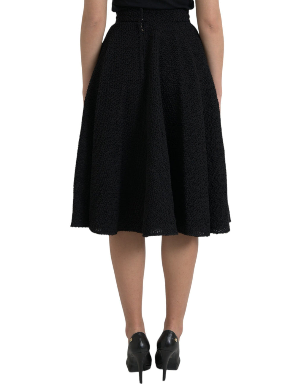 Jupe noire Dolce & Gabbana à taille haute, coupe évasée, longueur genou, en tissu élégant et fluide.