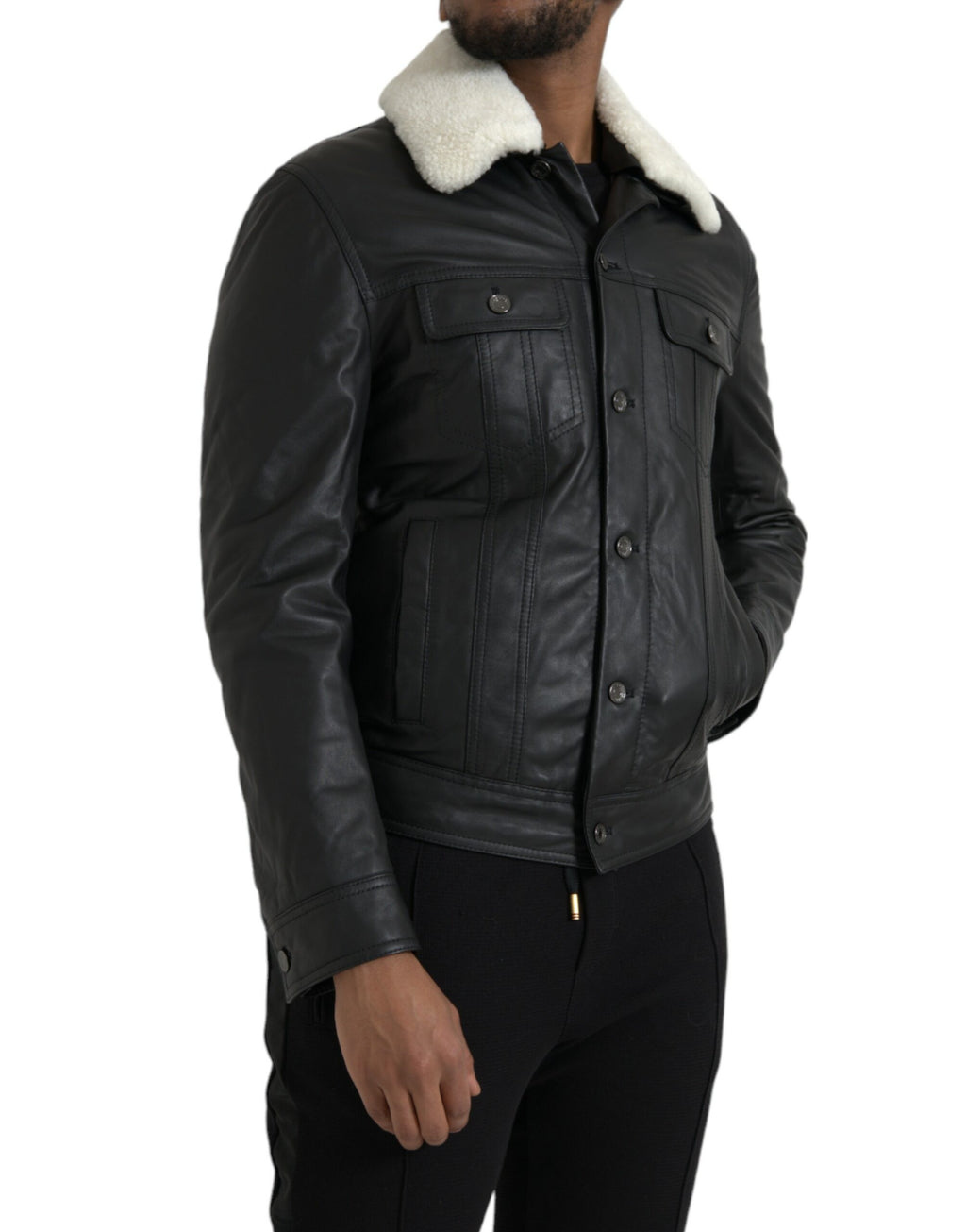 Manteau en cuir noir Dolce & Gabbana avec col en fourrure, style biker, veste élégante et tendance pour femme.