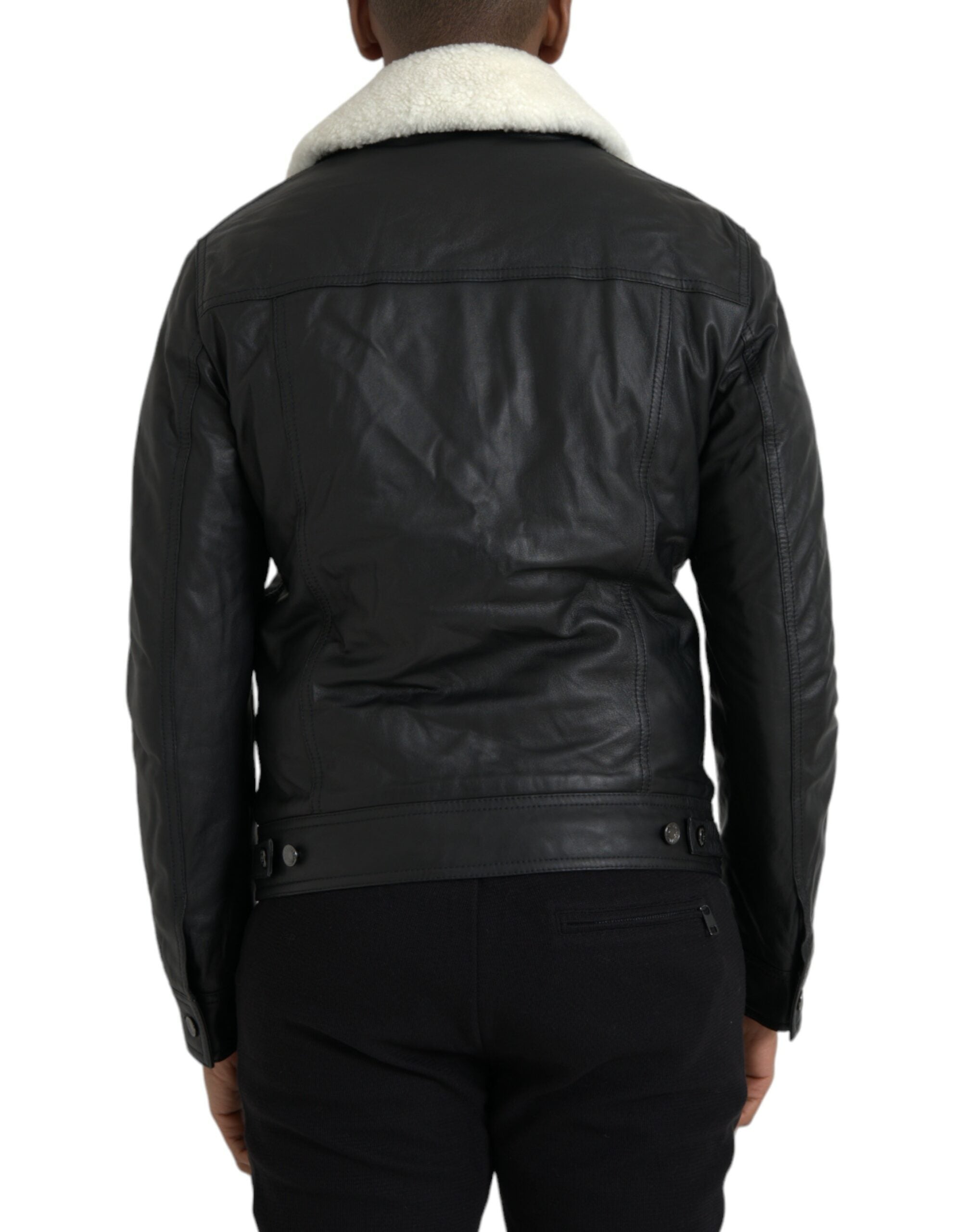Manteau noir en cuir avec col en fourrure, veste biker Dolce & Gabbana, style élégant et sophistiqué.