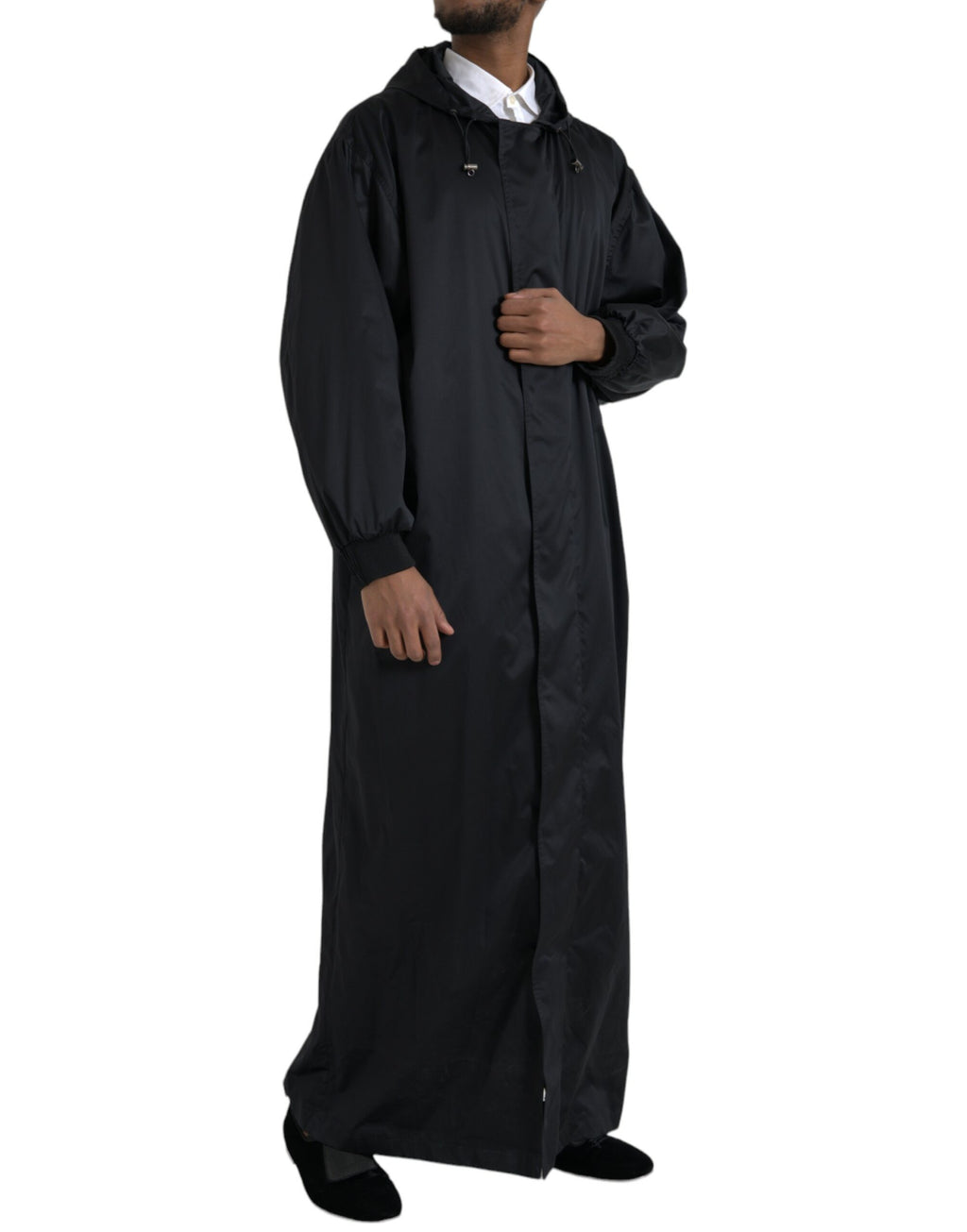 Veste longue coupe-vent noire en polyester avec capuche de la marque Dolce & Gabbana, style moderne et pratique.