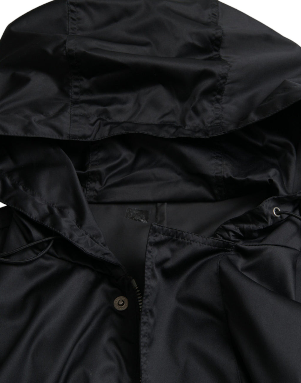 Veste coupe-vent noire en polyester Dolce & Gabbana avec capuche, longue et ajustée, idéale pour le style urbain et la protection contre le vent