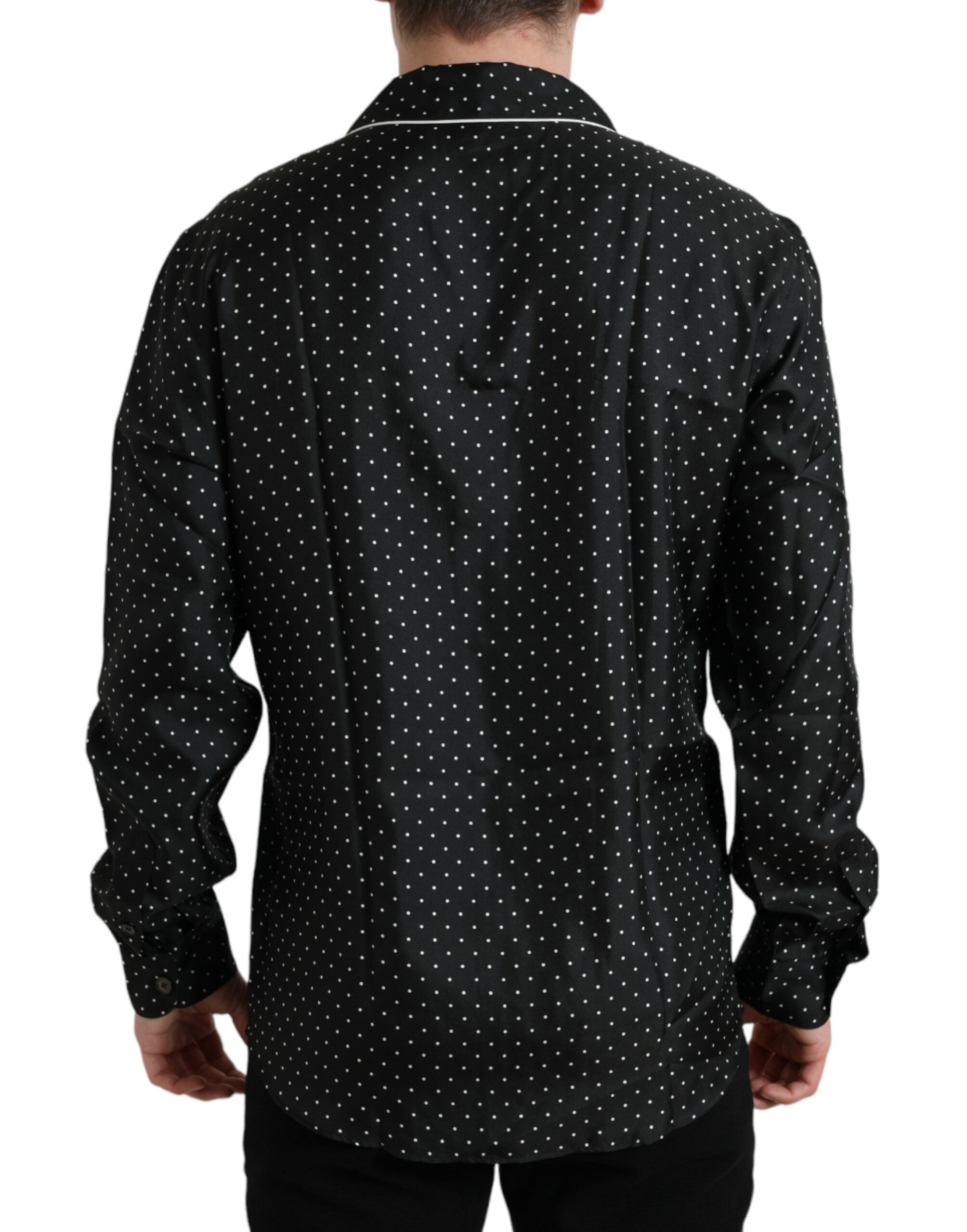 Chemise longue en soie noire à pois blancs de Dolce & Gabbana, manches longues et coupe élégante.